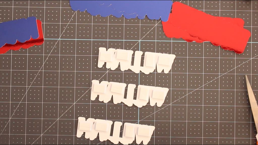 DIY 3D layered name made with Cricut Design Space, stacked with foam adhesive for a raised effect on a gable box.