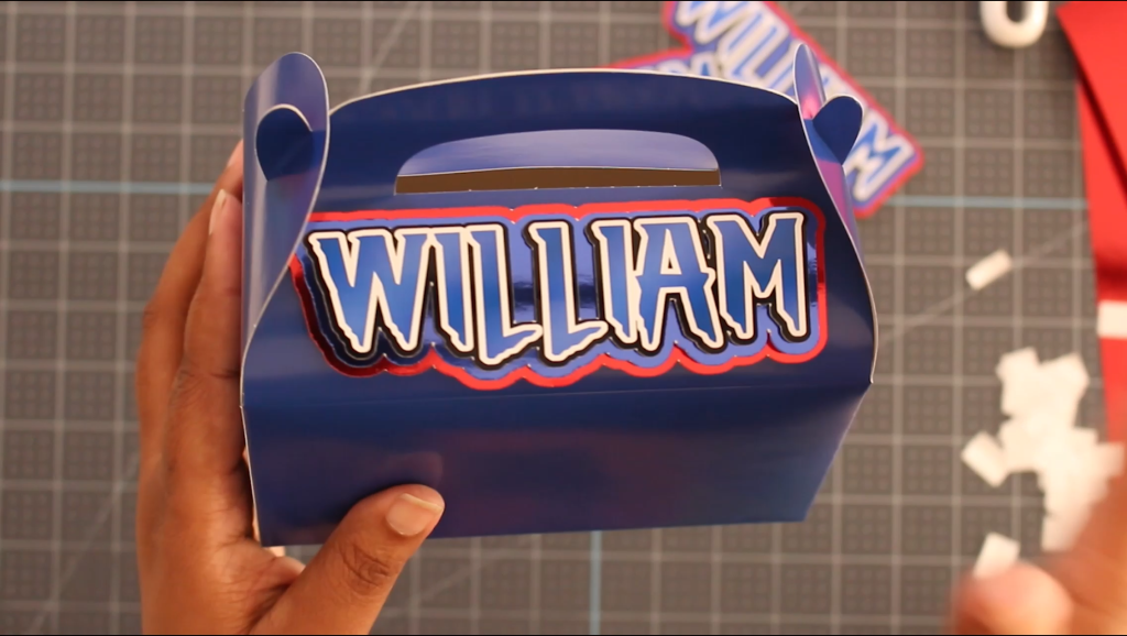 Custom 3D layered name attached to a party favor box, perfect Cricut DIY for weddings, birthdays, and baby showers
